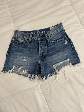 Free People Mid-Rise Distressed Denim Shorts in Blue